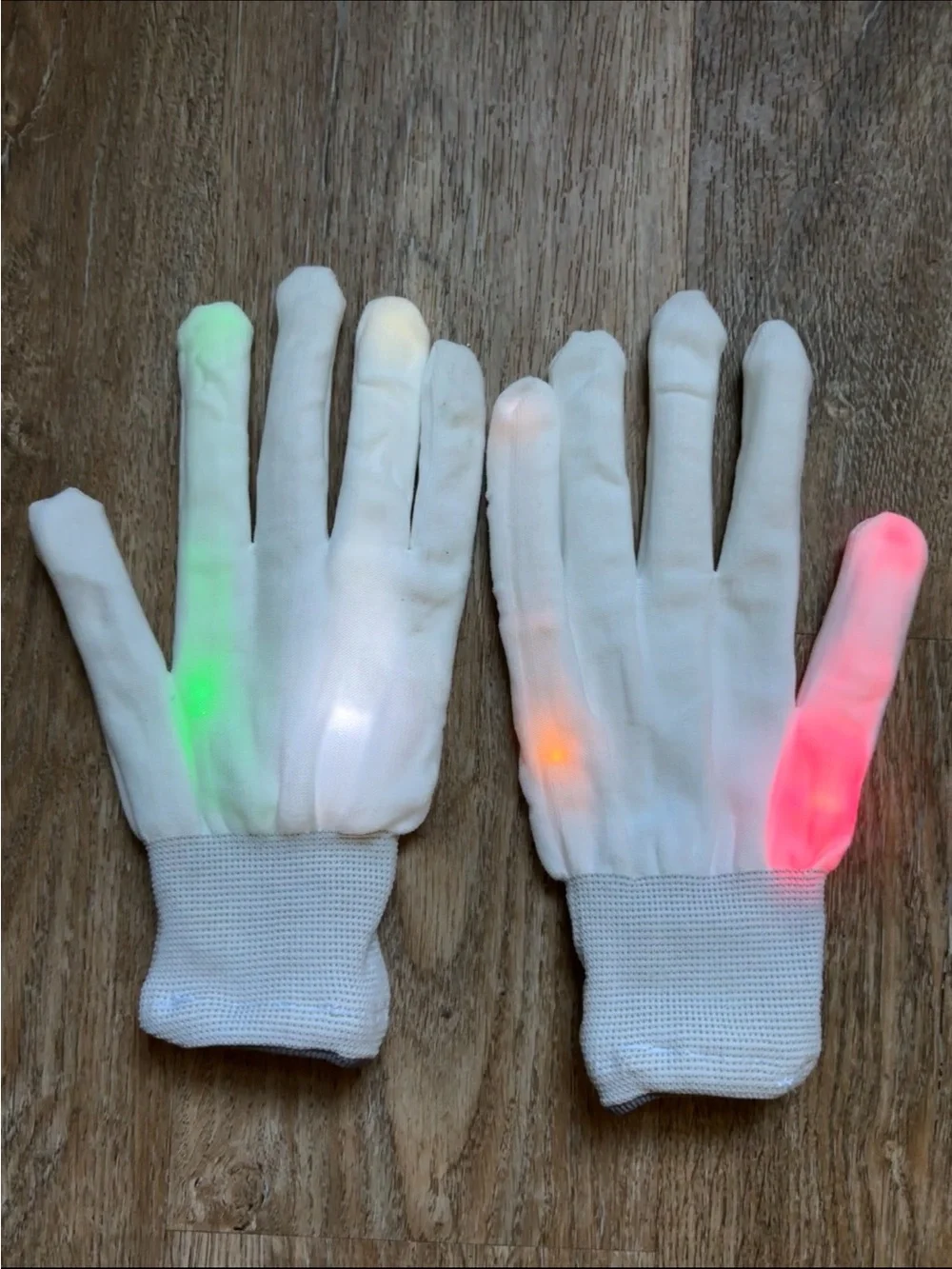 white knit LED light-up gloves featuring colorful flashing lights